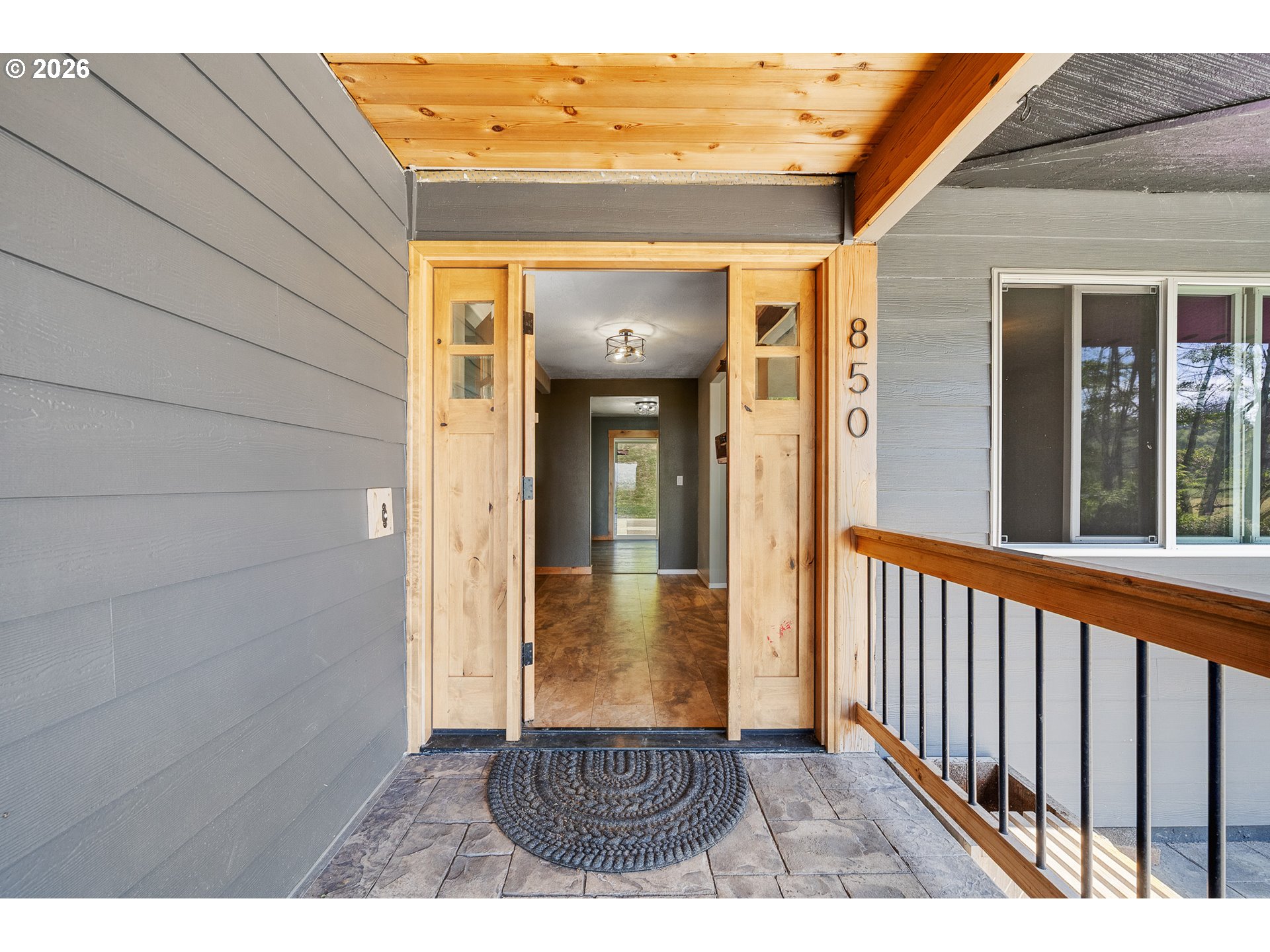 850 Hodgdon Road Tillamook, OR 97141 - Photo 4 of 43 a view of a porch with wooden floor and a door
