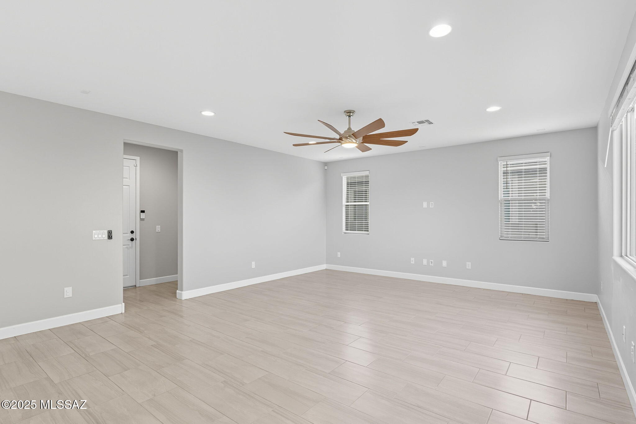 12100 East Ryscott Circle Vail, AZ 85641 - Photo 8 of 53 an empty room with windows and ceiling fan