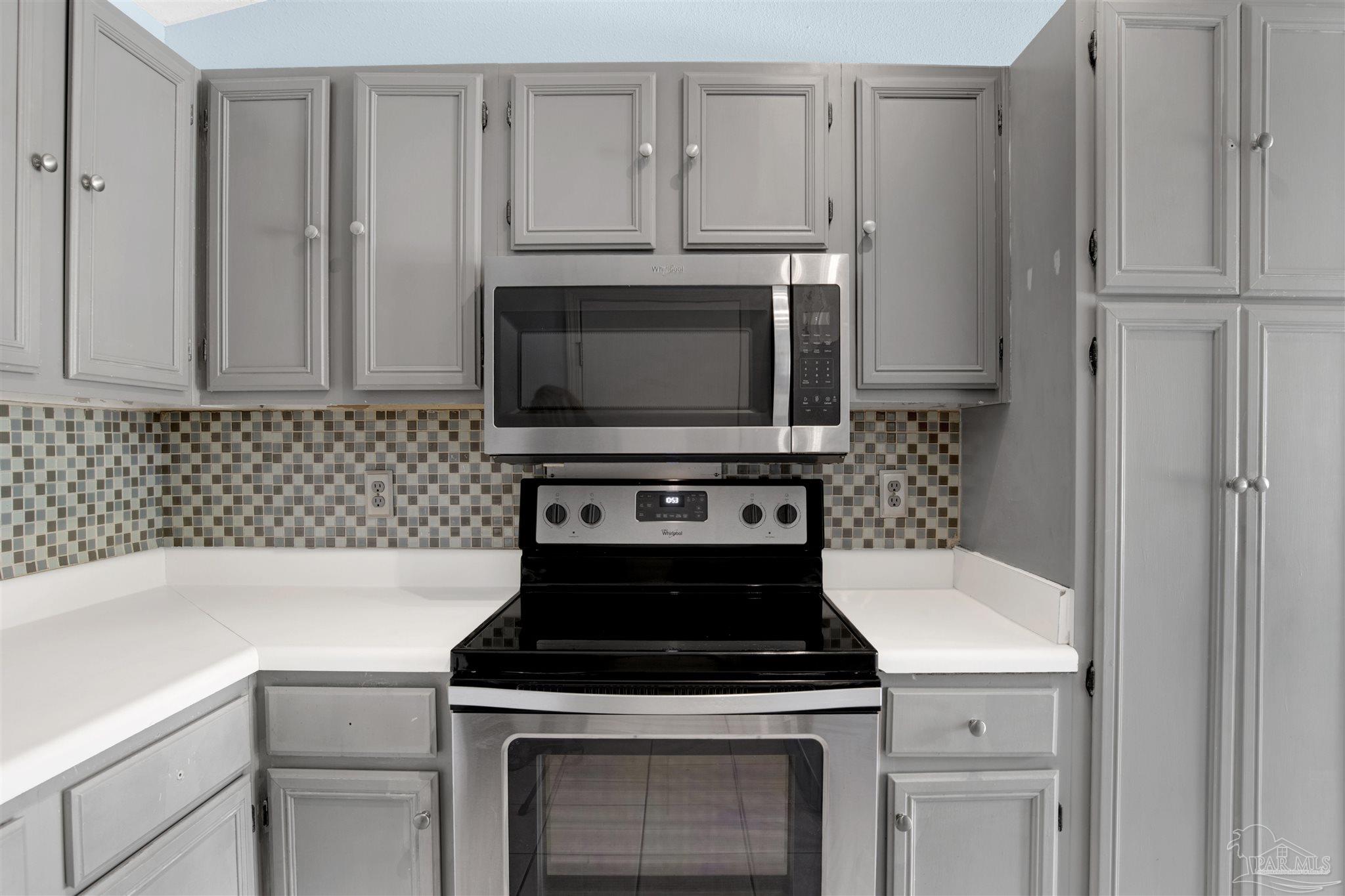 3437 Riverside Drive Pensacola, FL 32514 - Photo 11 of 27 a kitchen with cabinets and appliances