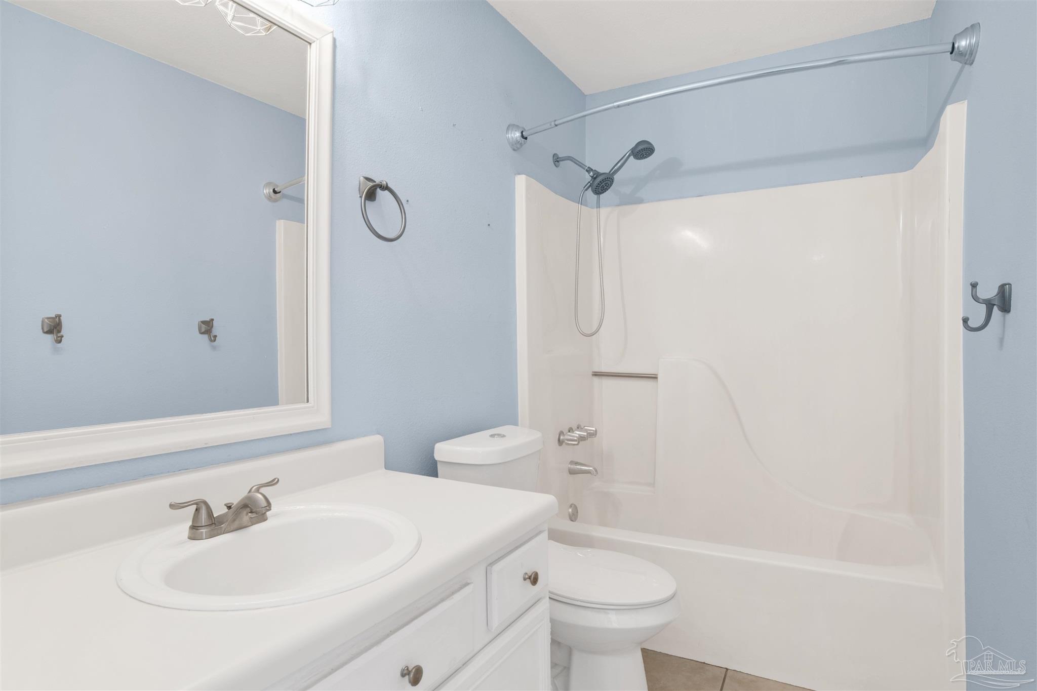 3437 Riverside Drive Pensacola, FL 32514 - Photo 15 of 27 a bathroom with a sink toilet and shower