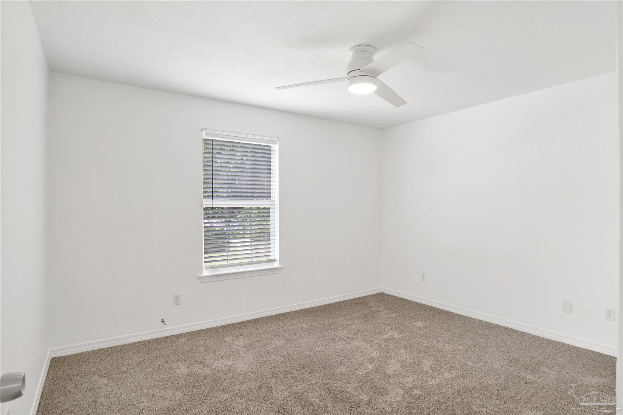 3437 Riverside Drive Pensacola, FL 32514 - Photo 18 of 27 an empty room with windows