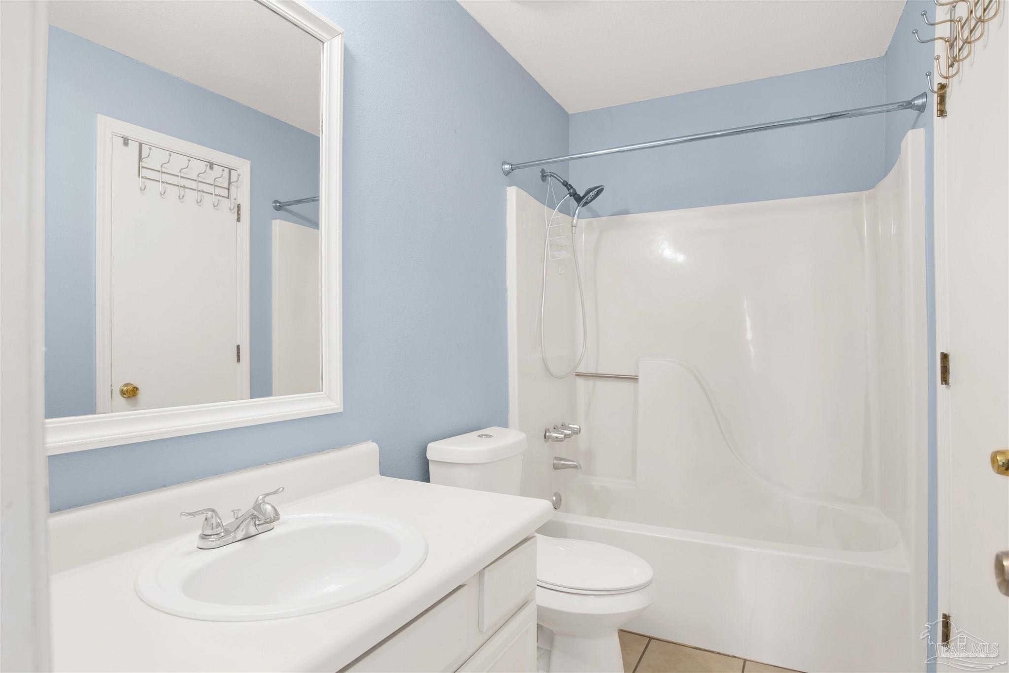 3437 Riverside Drive Pensacola, FL 32514 - Photo 19 of 27 a bathroom with a sink toilet and shower