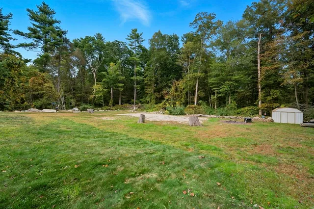 a backyard of a house with lots of green space