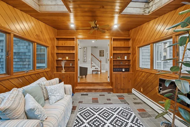 a living room with furniture and entry gate