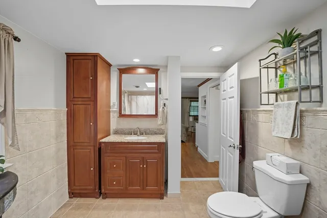 a bathroom with a toilet sink and shower