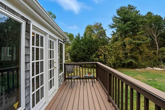 a view of balcony with wooden floor and fence and floor