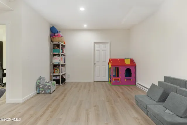 a living room with furniture and a ceiling fan