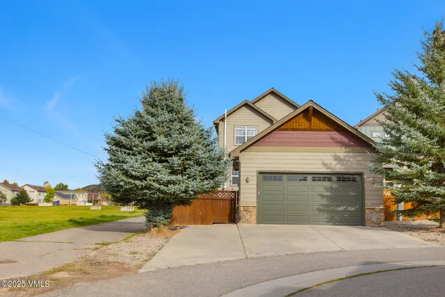 a view of a backyard with sitting area