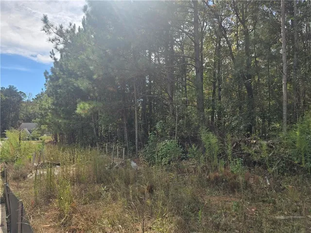a view of a lake view with lots of bushes