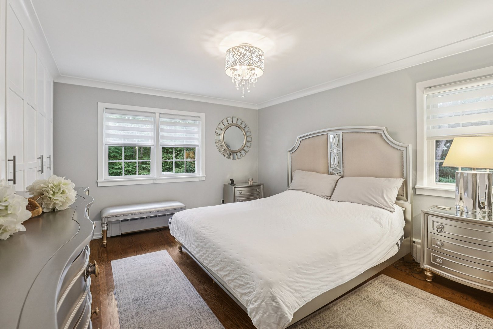 1834 West Palatine Road Palatine, IL 60067 - Photo 17 of 56 a bedroom with a bed and a chandelier