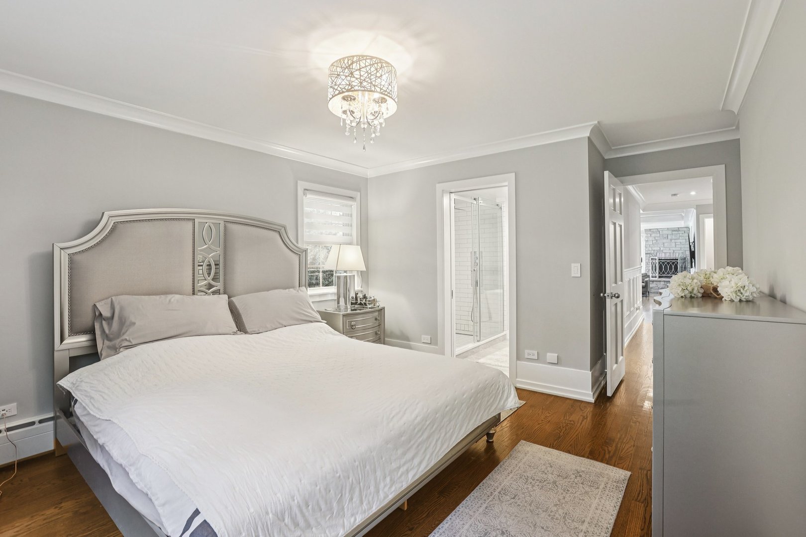 1834 West Palatine Road Palatine, IL 60067 - Photo 18 of 56 a bedroom with a bed and a chandelier