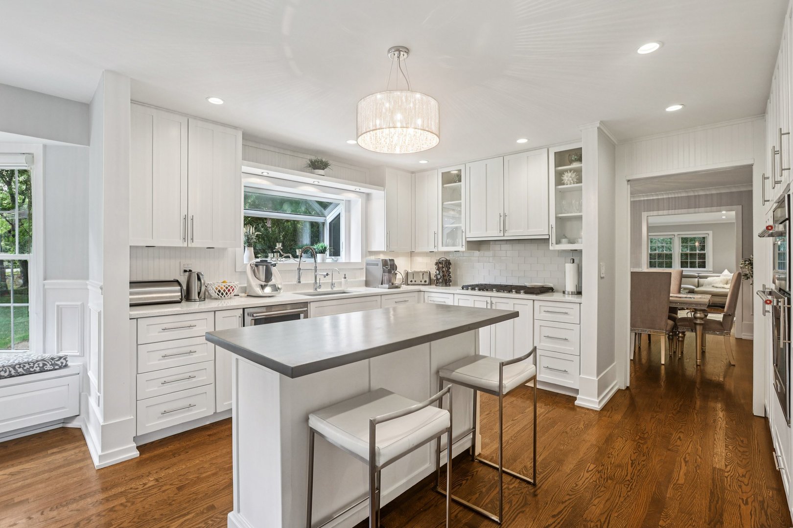 1834 West Palatine Road Palatine, IL 60067 - Photo 10 of 56 a kitchen with stainless steel appliances granite countertop a stove a sink dishwasher a microwave oven and a dining table with wooden floor