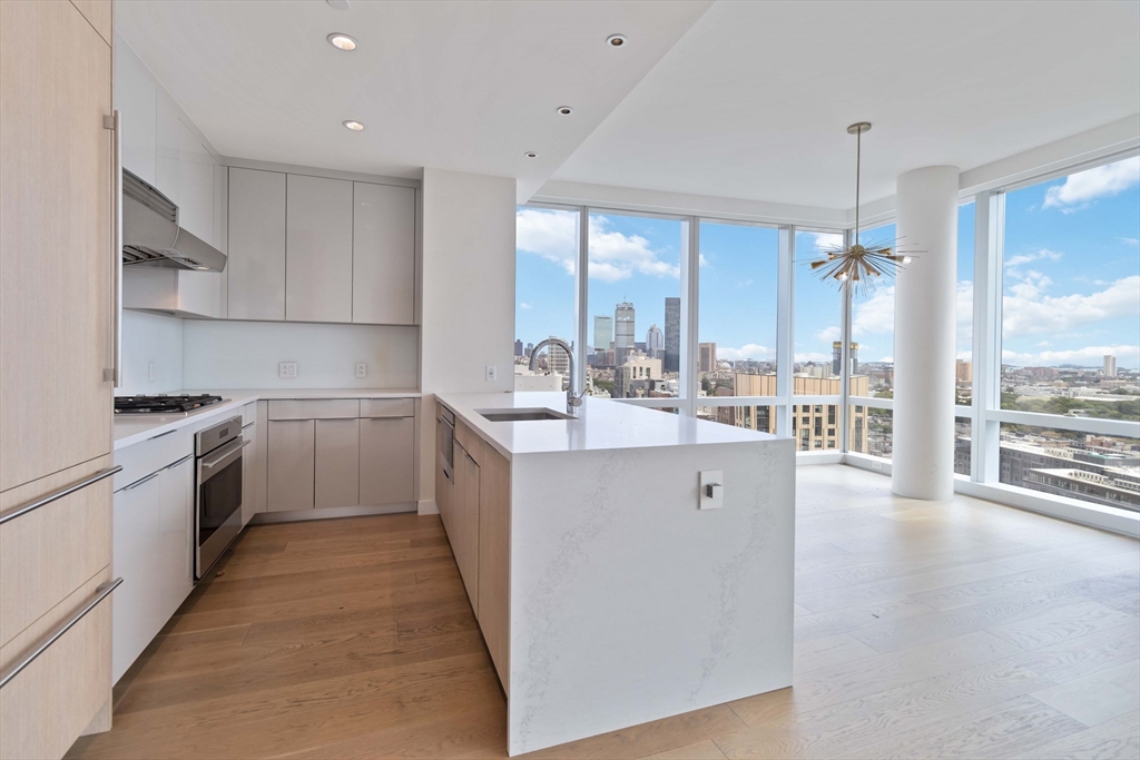 188 Brookline Avenue, Unit 20J Boston, MA 02215 - Photo 2 of 28 a kitchen with a sink a counter top space stainless steel appliances and cabinets