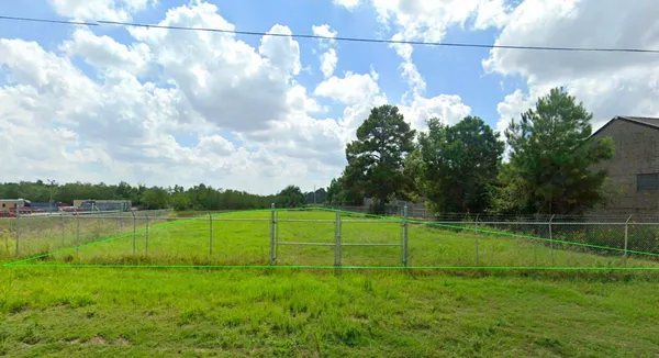 a view of a golf course with a lake