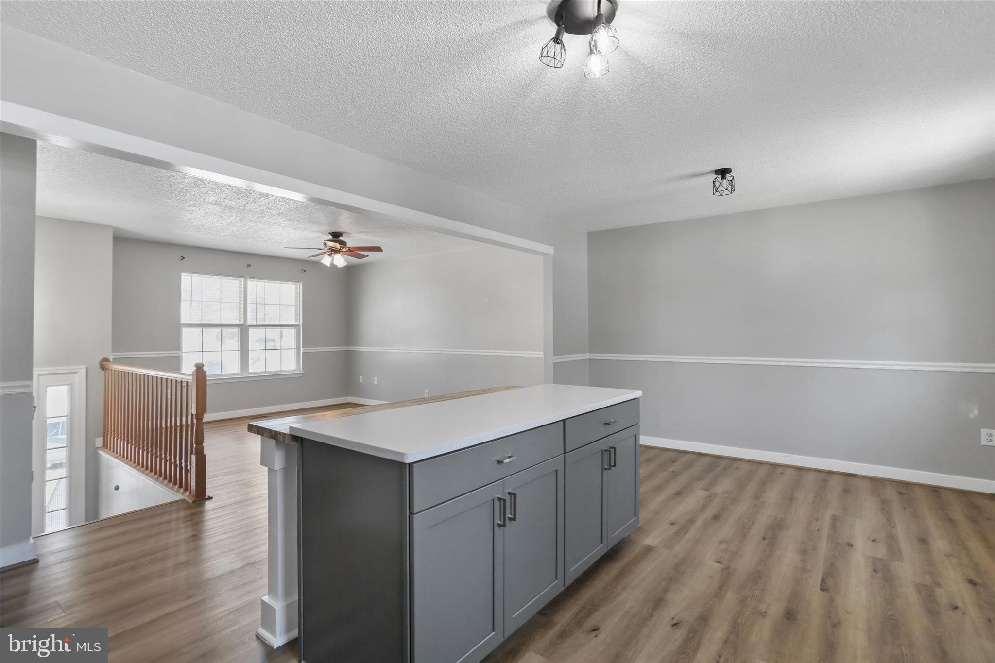 137 Woodrow Road Winchester, VA 22602 - Photo 19 of 45 a kitchen with a wooden floor and window