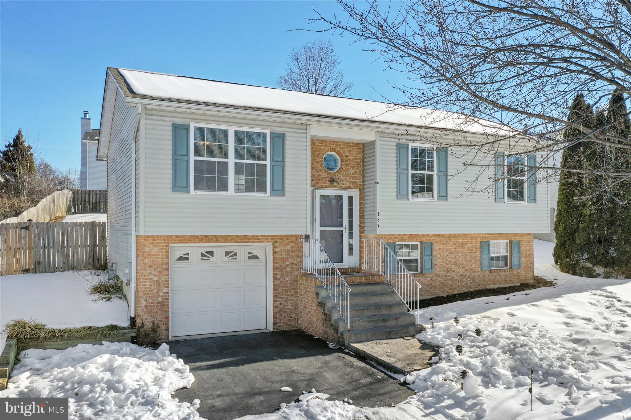 137 Woodrow Road Winchester, VA 22602 - Photo 3 of 45 a front view of a house with a yard