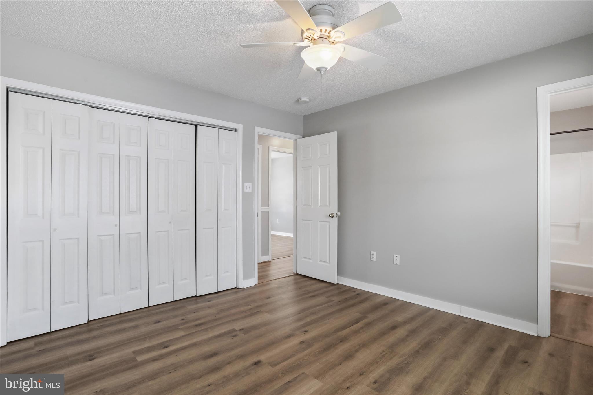 137 Woodrow Road Winchester, VA 22602 - Photo 10 of 45 a view of an empty room with wooden floor