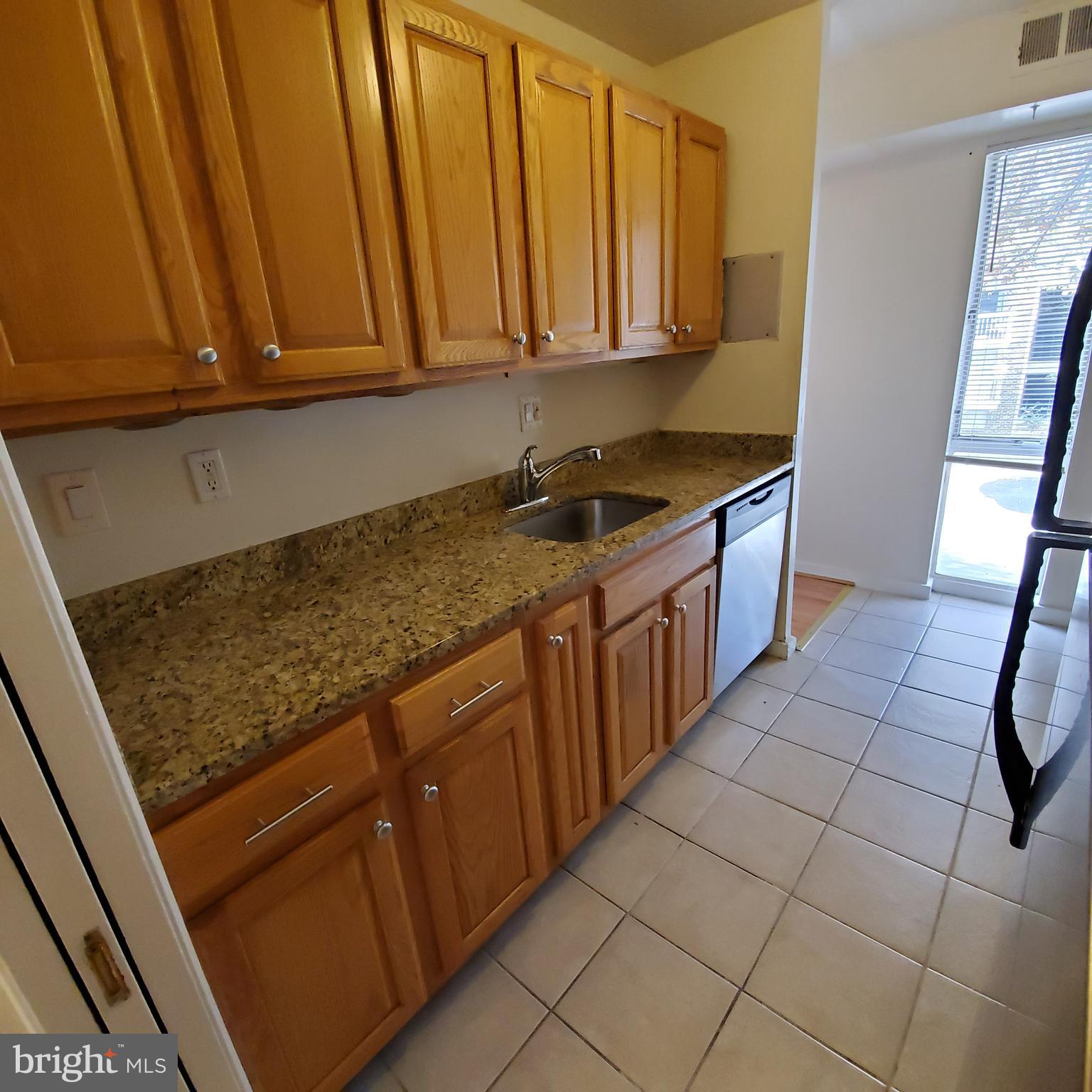 3342 Hewitt Avenue Silver Spring, MD 20906 - Photo 6 of 20 Kitchen features granite counters and gas cooking.