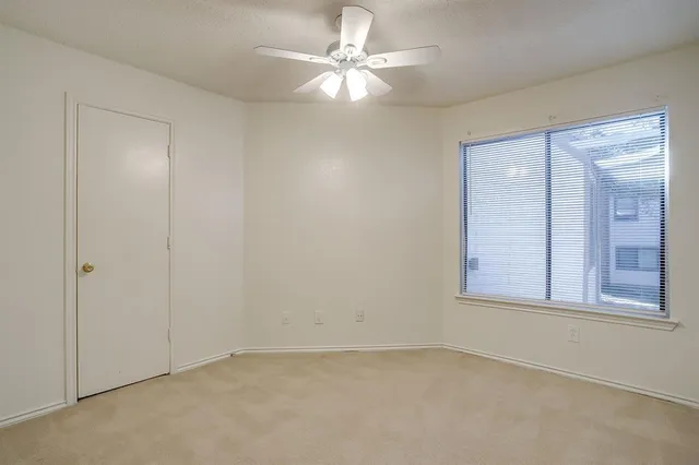 an empty room with a bathroom