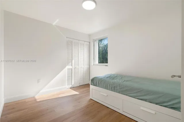 a view of a room with wooden floor and staircase
