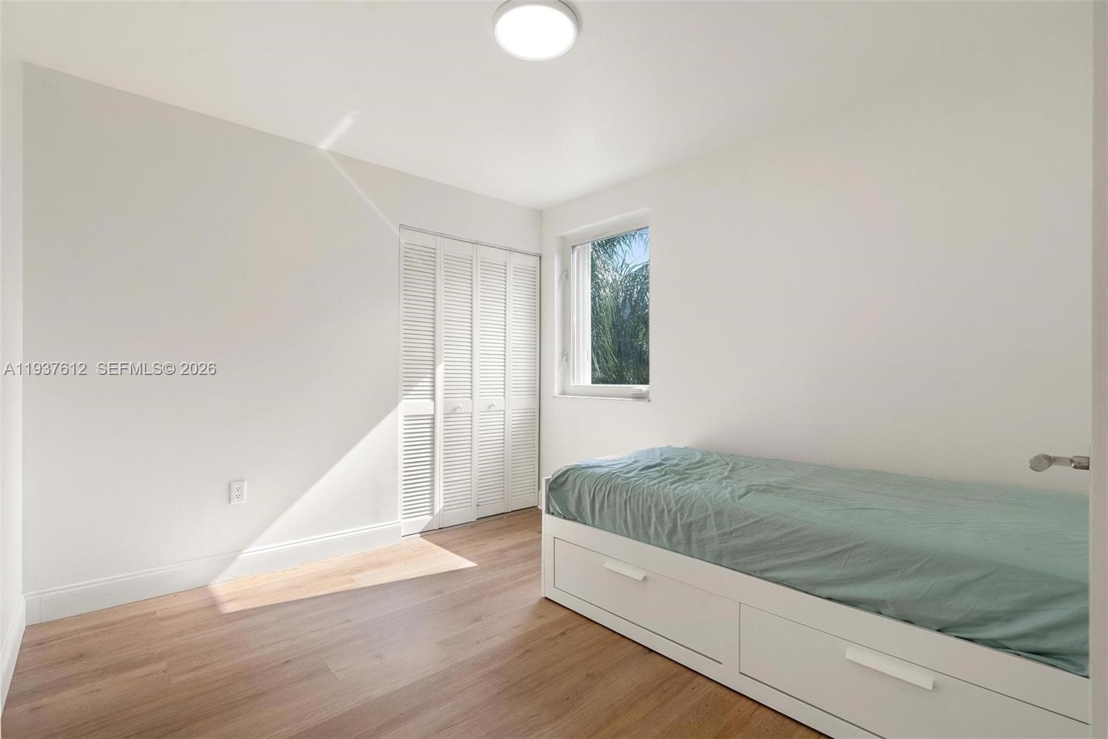 6830 Southwest 45th Lane, Unit 2 Miami, FL 33155 - Photo 13 of 21 a view of a room with wooden floor and staircase