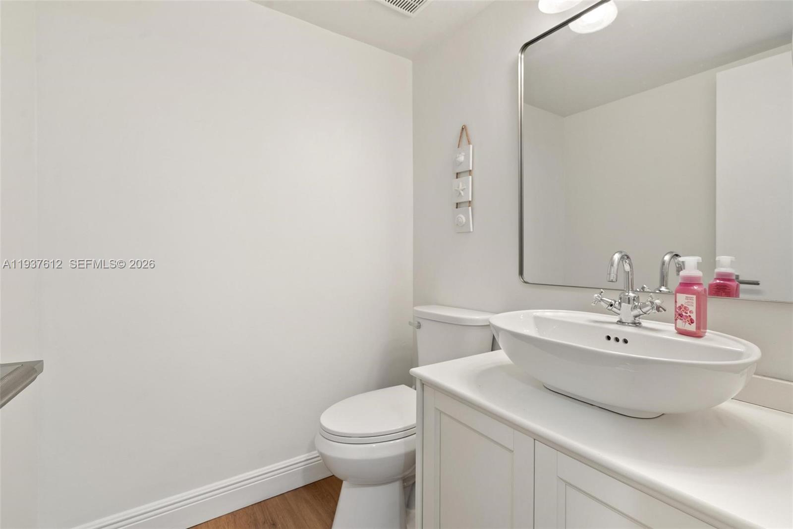 6830 Southwest 45th Lane, Unit 2 Miami, FL 33155 - Photo 15 of 21 a bathroom with a sink and a toilet