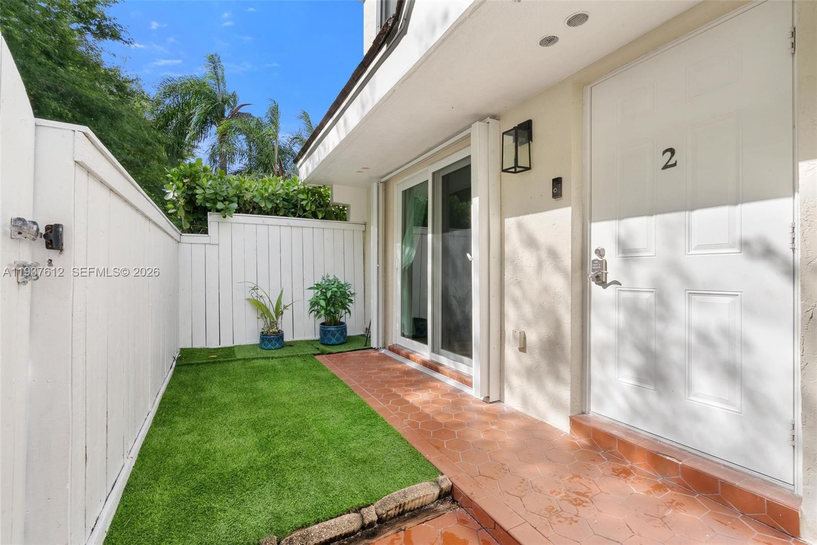 6830 Southwest 45th Lane, Unit 2 Miami, FL 33155 - Photo 3 of 21 a view of backyard with garden