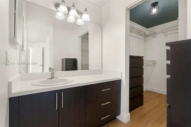 a kitchen with a sink and refrigerator