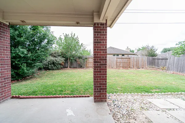 a view of a back yard from a balcony