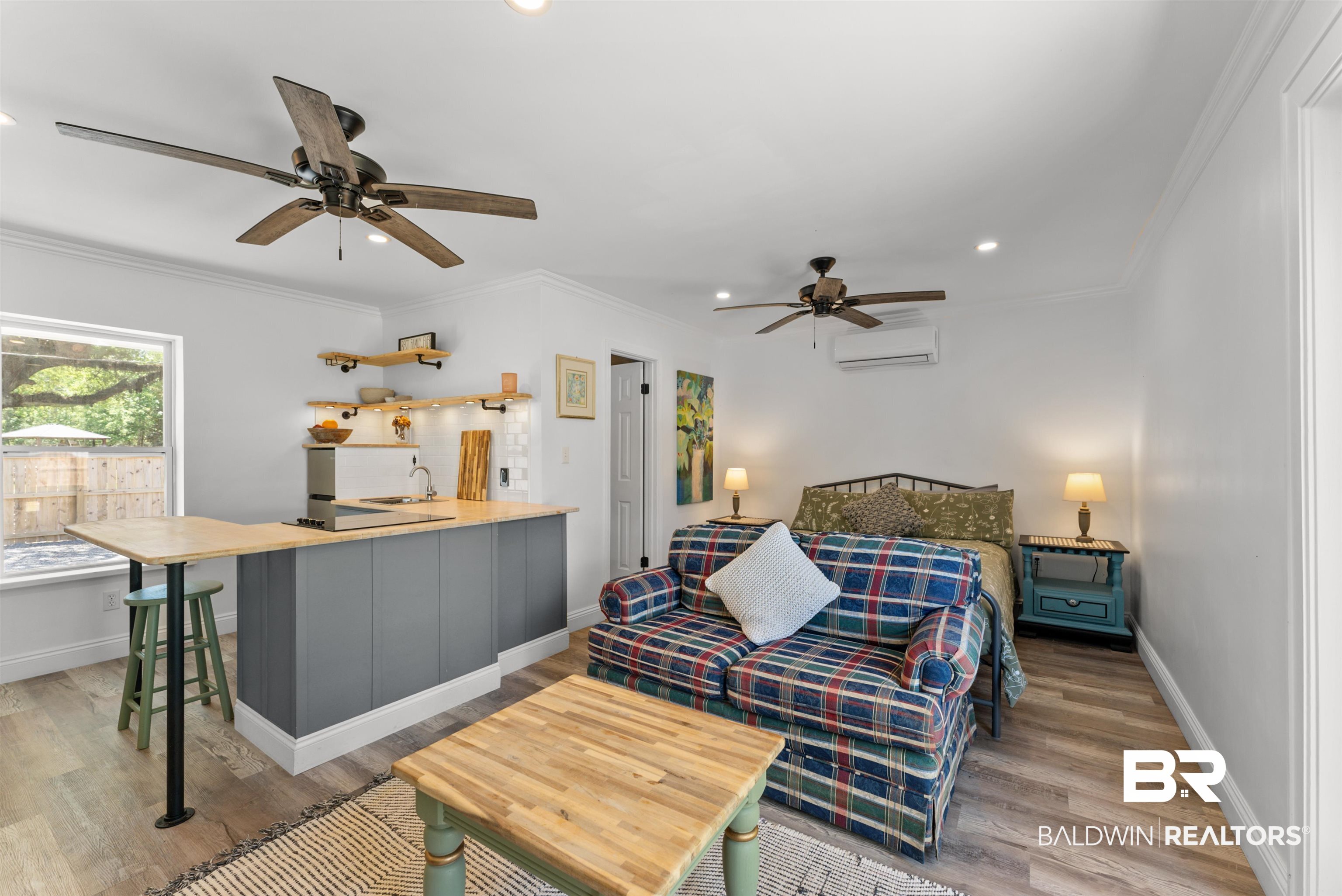 6447 Bemis Lane Bon Secour, AL 36511 - Photo 28 of 62 Open-concept living space featuring wood-finish flooring, recessed lighting, and white walls