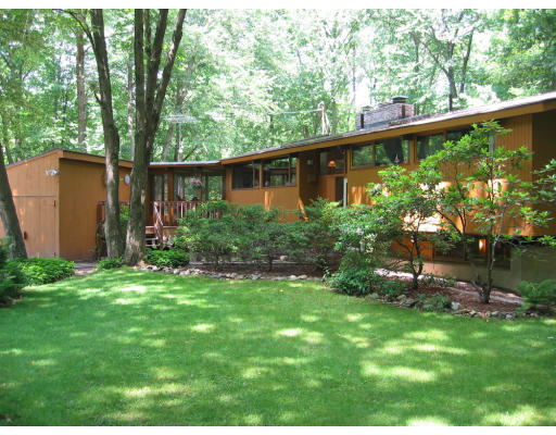 50 Woodside Road Harvard, MA 01451 - Photo 1 of 13 a garden view with a seating space