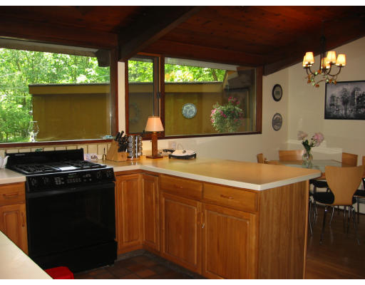 50 Woodside Road Harvard, MA 01451 - Photo 4 of 13 a kitchen with a sink and large cabinets