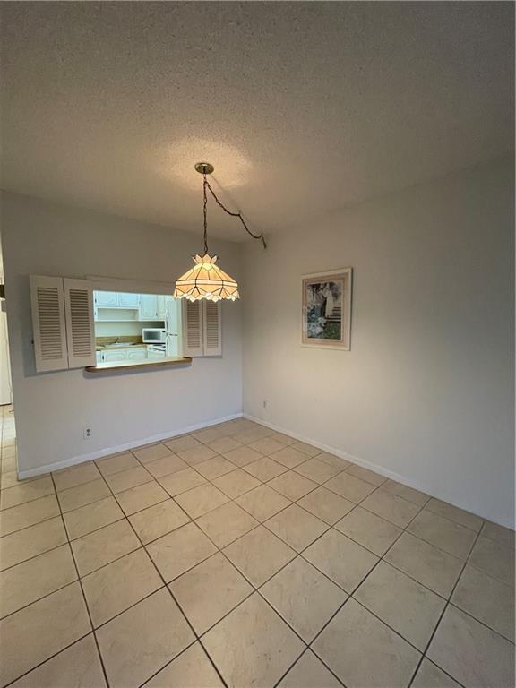 9233 Southwest 8th Street, Unit 220 Boca Raton, FL 33428 - Photo 11 of 23 a view of a kitchen with furniture and wooden floor