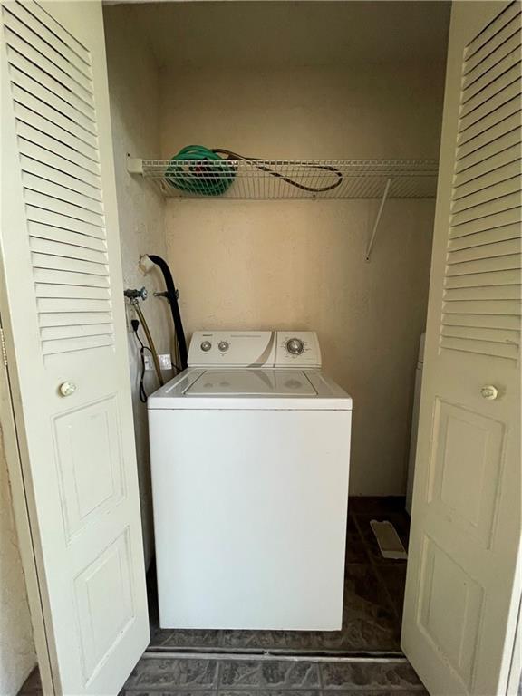 9233 Southwest 8th Street, Unit 220 Boca Raton, FL 33428 - Photo 20 of 23 a utility room with dryer and washer