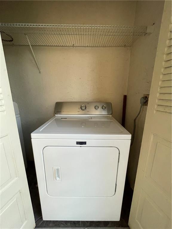 9233 Southwest 8th Street, Unit 220 Boca Raton, FL 33428 - Photo 21 of 23 a utility room with dryer and washer