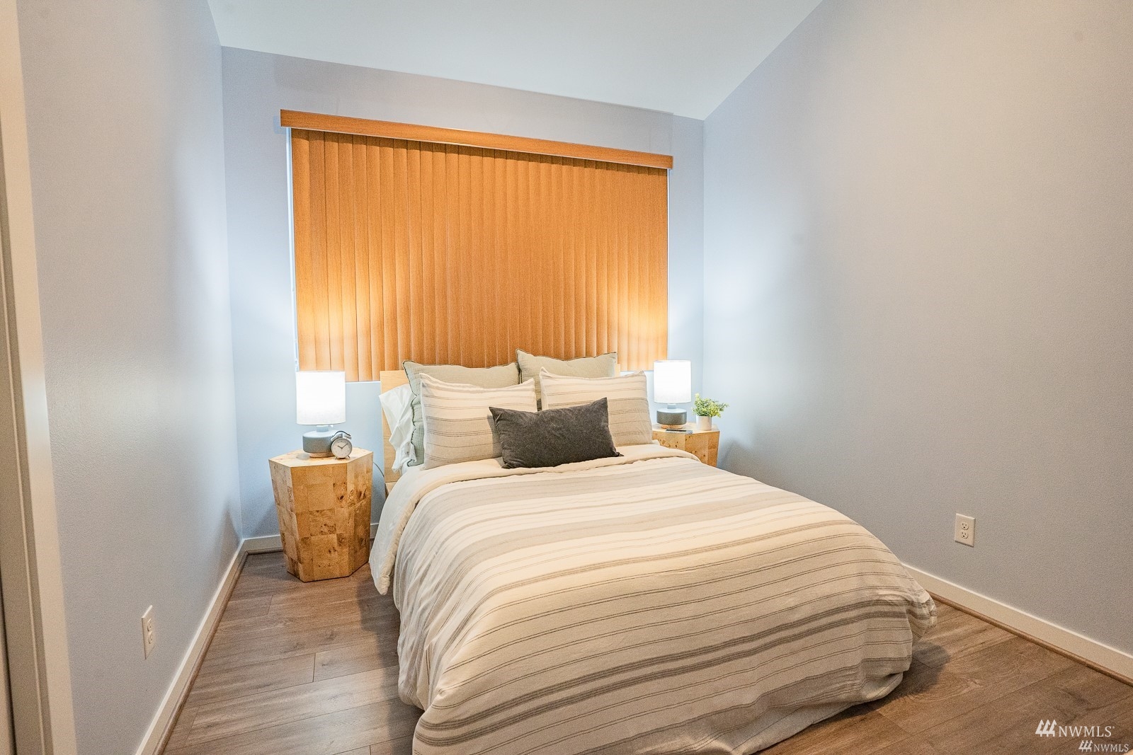 870 Southwest 96th Place Seattle, WA 98106 - Photo 14 of 27 a large bed sitting in a bedroom next to a window