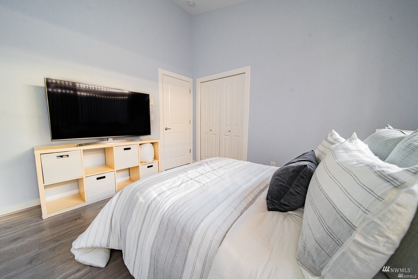 870 Southwest 96th Place Seattle, WA 98106 - Photo 15 of 27 a bedroom with a bed and a flat screen tv