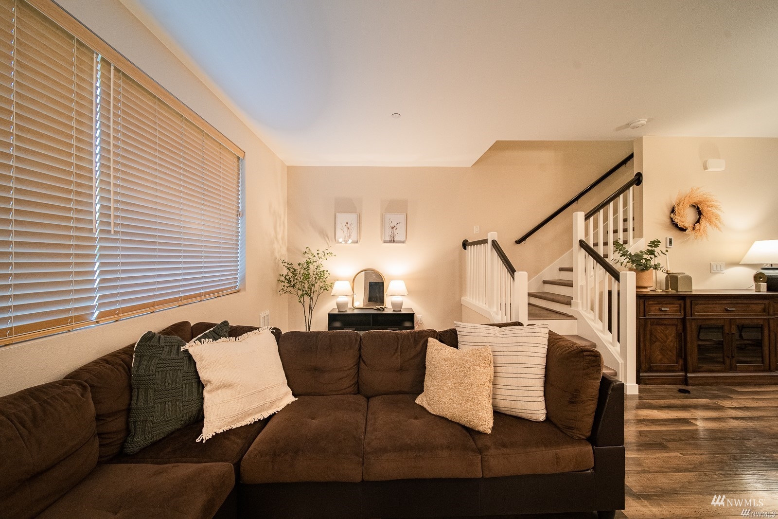 870 Southwest 96th Place Seattle, WA 98106 - Photo 5 of 27 a living room with couches and kitchen view with wooden floor