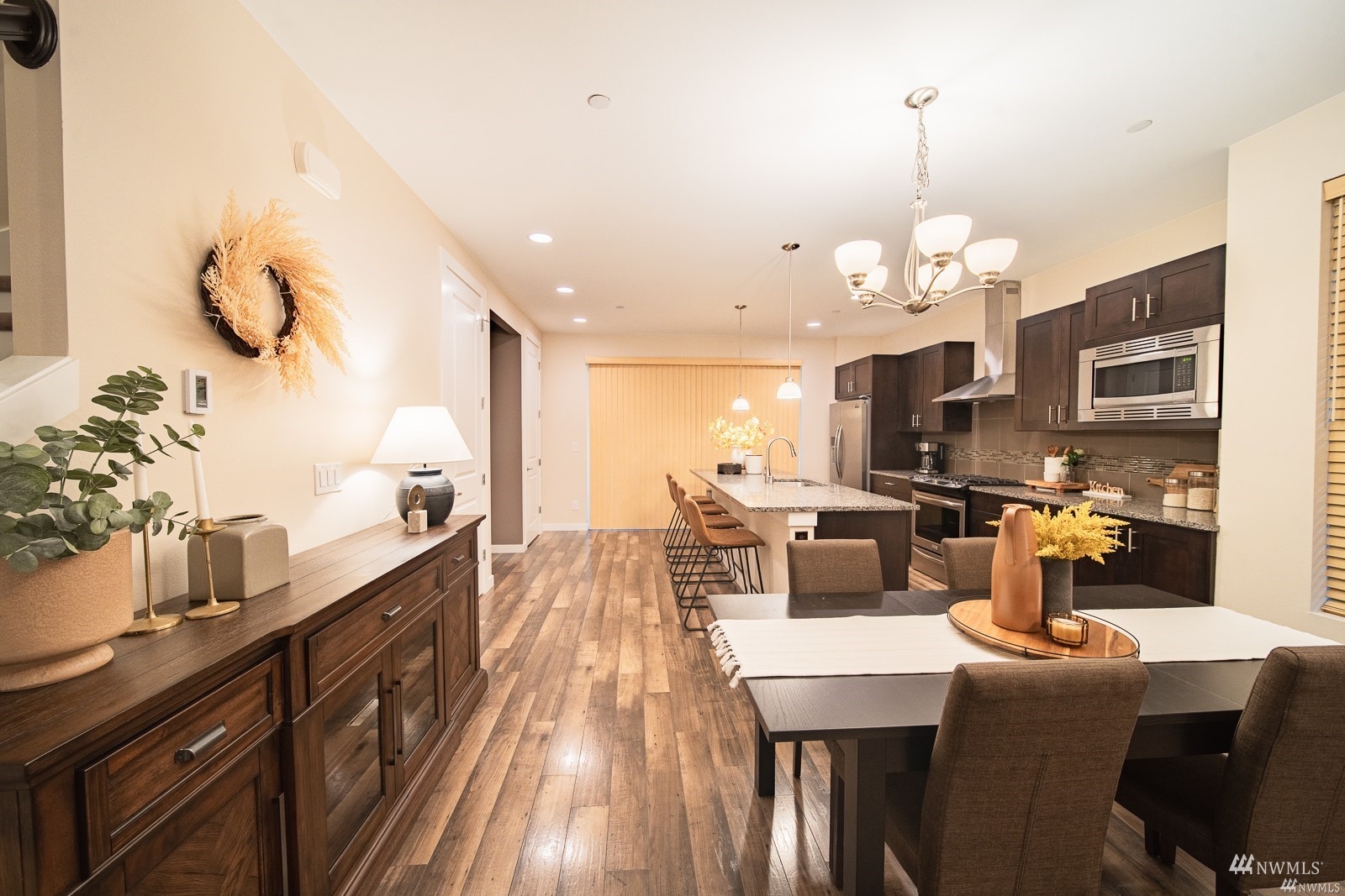 870 Southwest 96th Place Seattle, WA 98106 - Photo 7 of 27 a large kitchen with a table and chairs