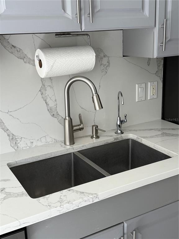 4688 Heather Terrace North Port, FL 34286 - Photo 11 of 35 a kitchen with a sink and a stove