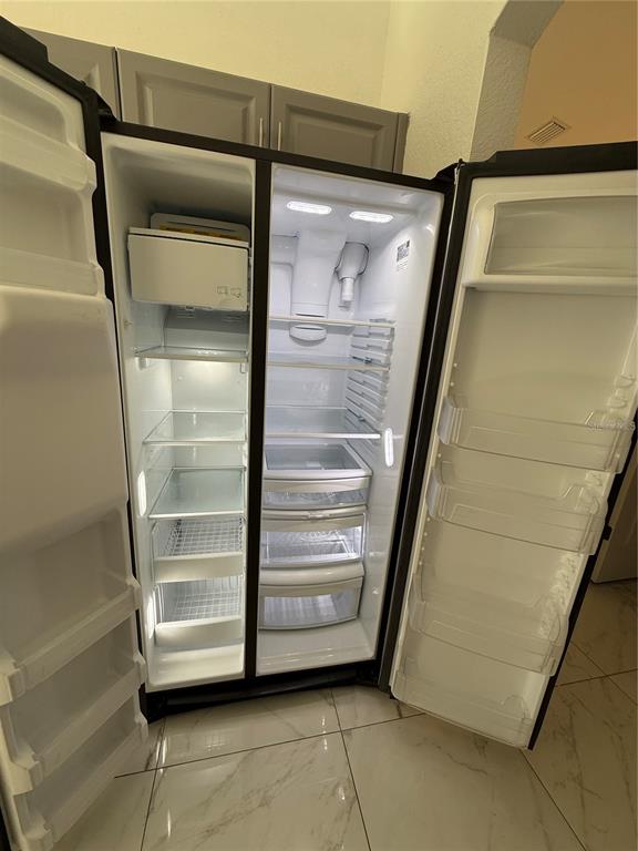4688 Heather Terrace North Port, FL 34286 - Photo 13 of 35 a view of walk in closet with empty racks