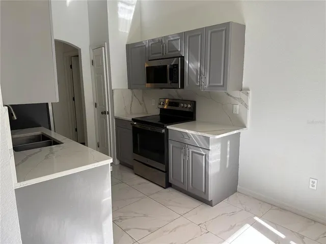 a view of an empty room with windows