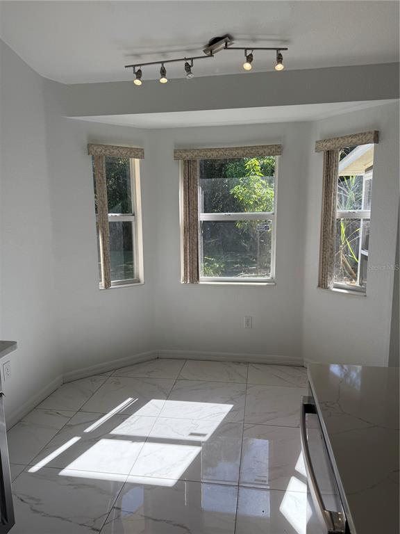 4688 Heather Terrace North Port, FL 34286 - Photo 17 of 35 a view of an empty room with windows