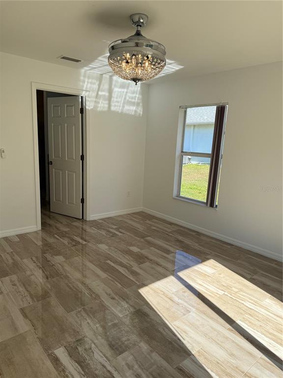 4688 Heather Terrace North Port, FL 34286 - Photo 20 of 35 a view of an empty room with a window