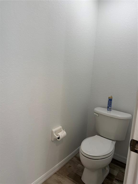 4688 Heather Terrace North Port, FL 34286 - Photo 26 of 35 a white toilet sitting next to a white sink