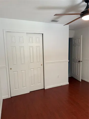 a bathroom with a shower a toilet and a sink