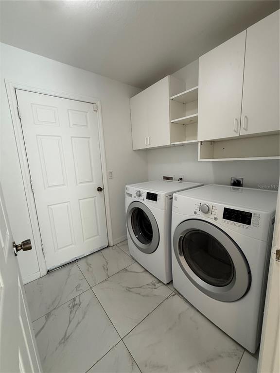 4688 Heather Terrace North Port, FL 34286 - Photo 33 of 35 a utility room with dryer and washer