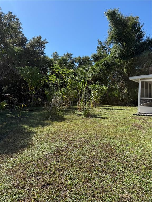 4688 Heather Terrace North Port, FL 34286 - Photo 35 of 35 a view of outdoor space with garden and trees