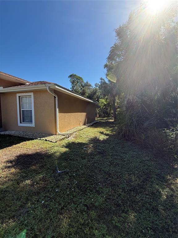 4688 Heather Terrace North Port, FL 34286 - Photo 4 of 35 a backyard of a house