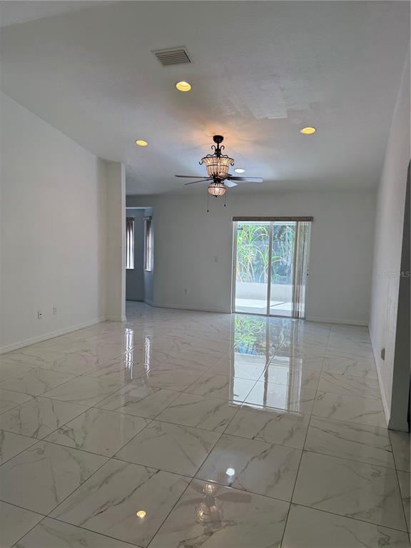 4688 Heather Terrace North Port, FL 34286 - Photo 6 of 35 a view of an empty room with a window